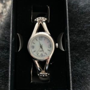 New bangle style watch with mother of pearl color face